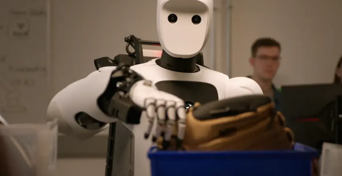 An image of Apptronik’s Apollo 2 robot taking a baseball glove off of a shelf