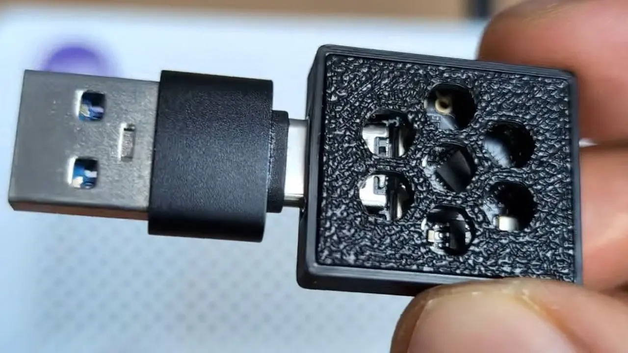 A close-up photo of a custom-built USB-and-Wi-Fi adblocker built by an enthusiast.