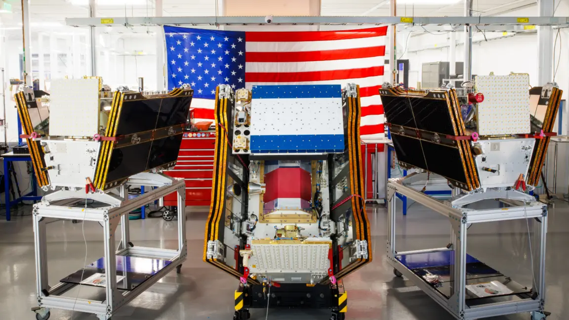 Three of the first operational satellites in the FireSat constellation sitting on carts in a building owned by California-based Muon Space.
